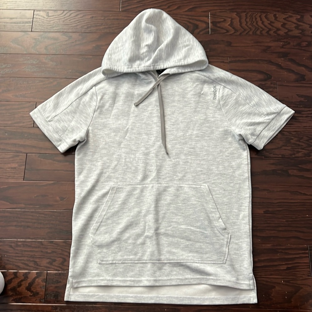 Women’s Reebok. short sleeve hoodie.  Front pocket.  Size Medium